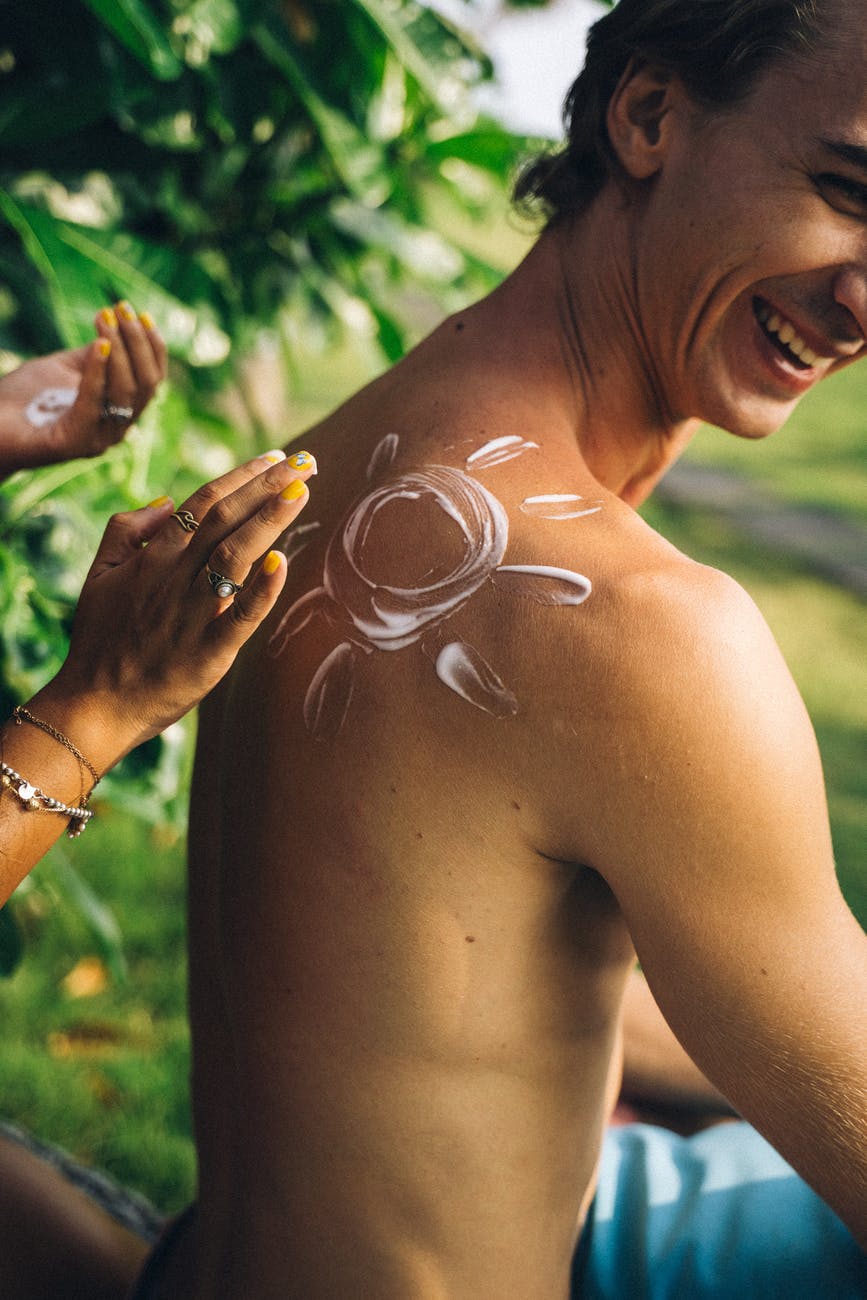 topless woman with white powder on her face