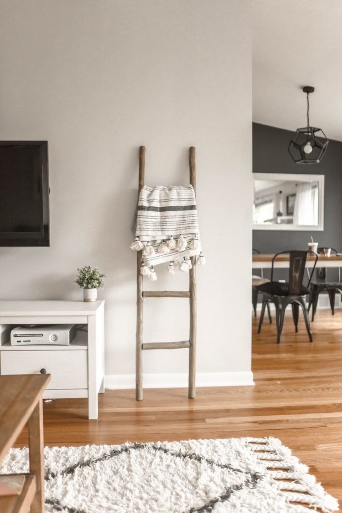 pexels-photo-1125136 gray wooden ladder on white painted wall