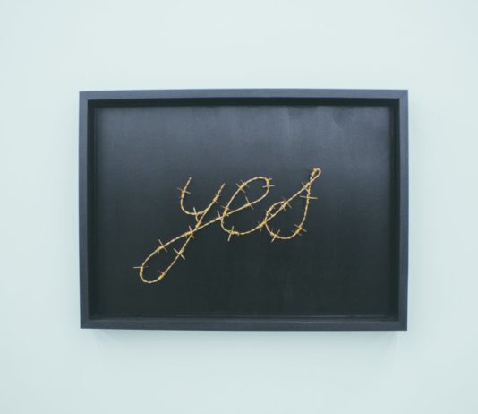 yes signage on brown wooden chalkboard