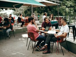 three men sitting at the table